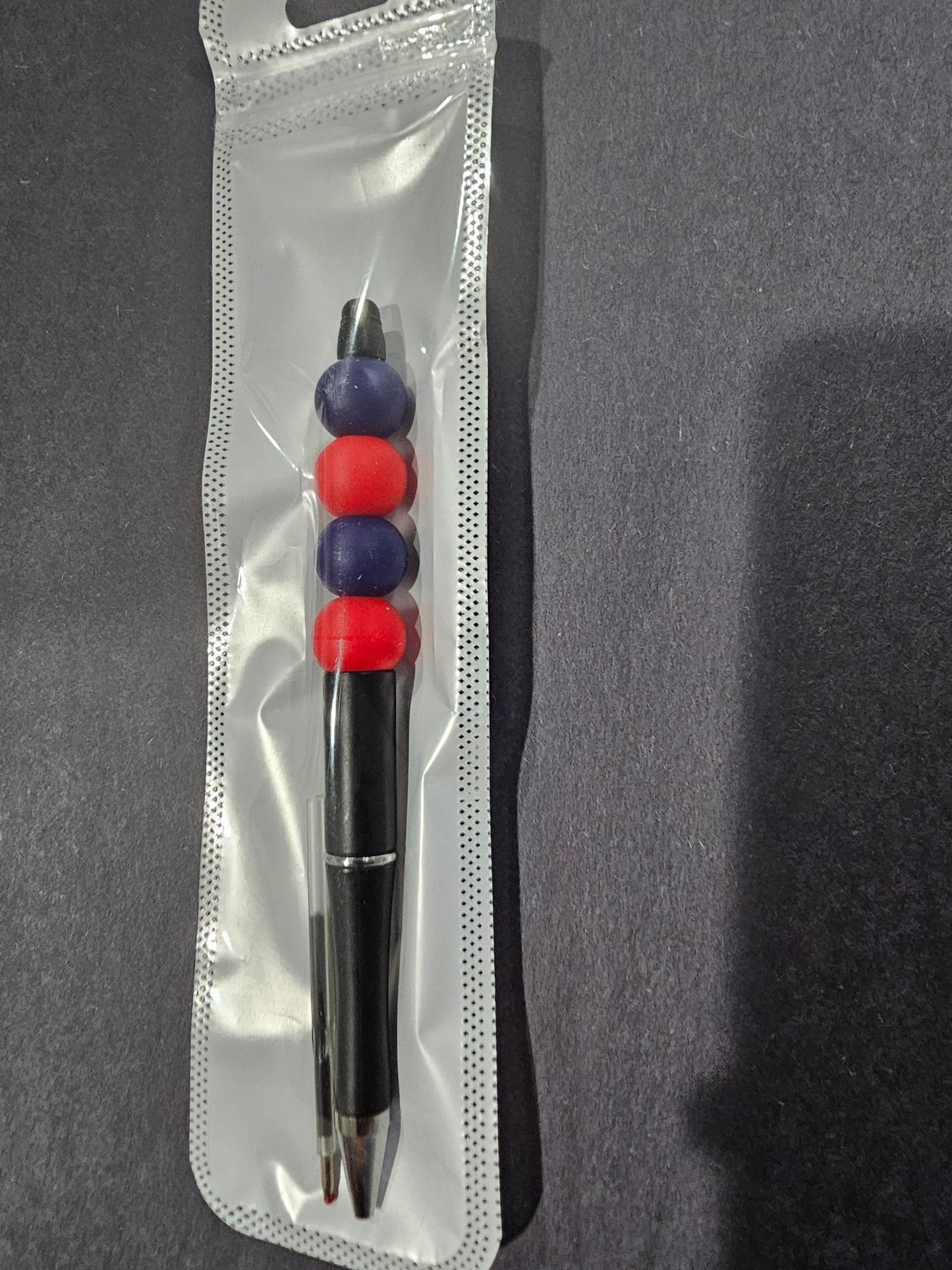 Black, Blue, and Red Pen